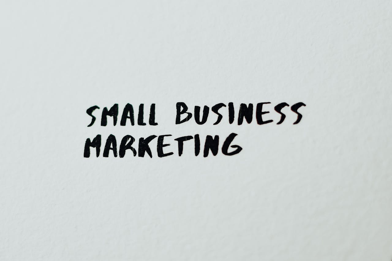 heros-img Text Small Business Marketing written on white paper for creative use.